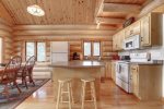 Dakota log Cabin kitchen with full log interior. 